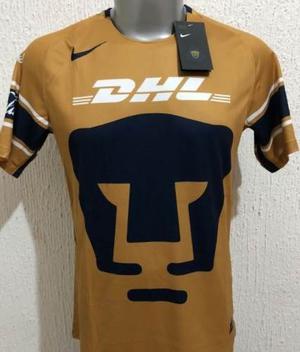 playera pumas dorada