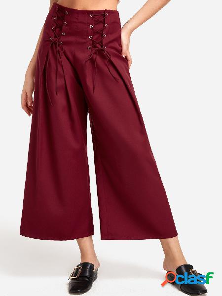 Pantalones anchos de talle medio con cordones y diseño de