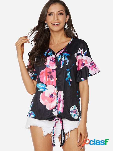 Diseño de botones negros con estampado floral al azar con